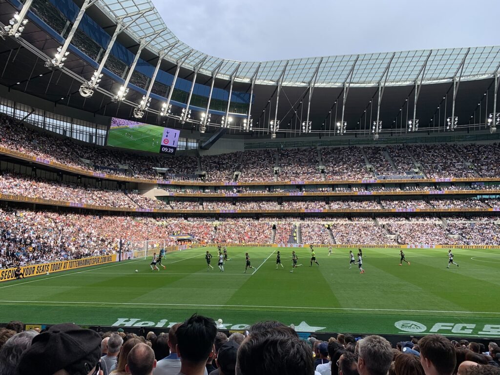 Atmospheric view of an English Premier League football stadium lit up for a match.